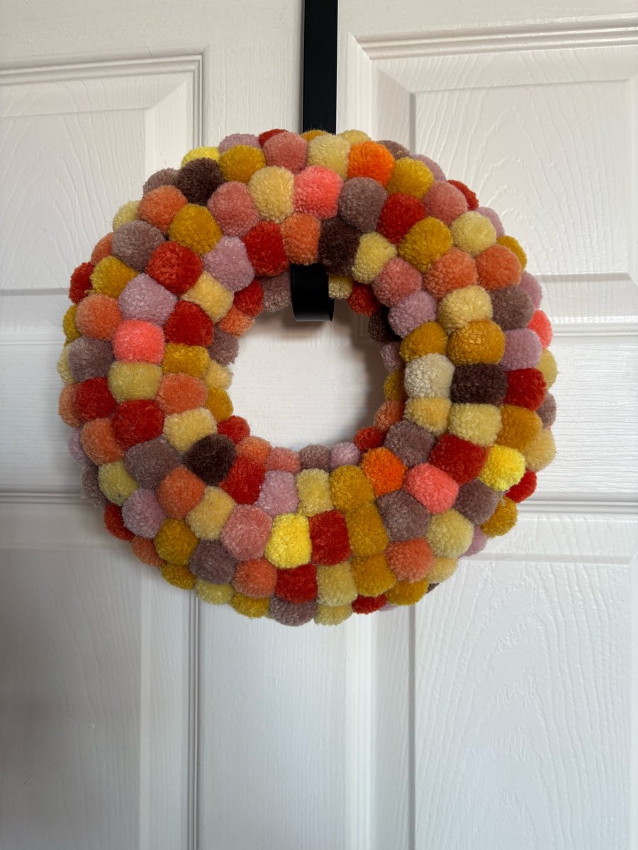 Spring wool Pom Pom wreath. 
