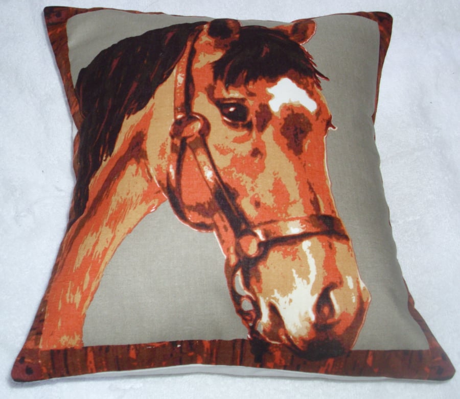 A beautiful brown horse looking over a stable door cushion 