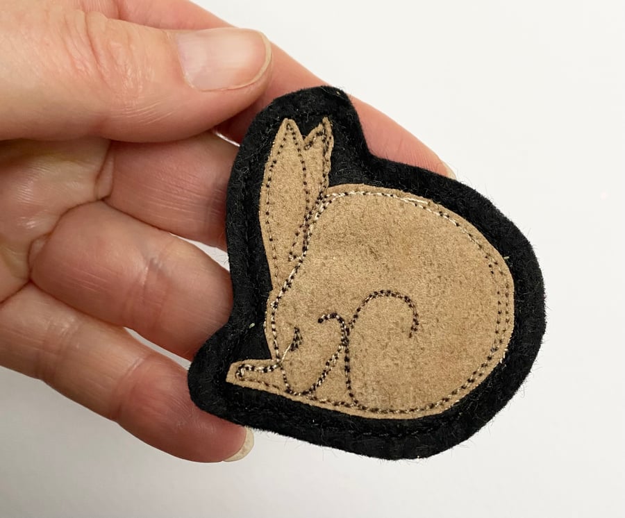 Upcycled sleeping hare brooch pin or badge. 