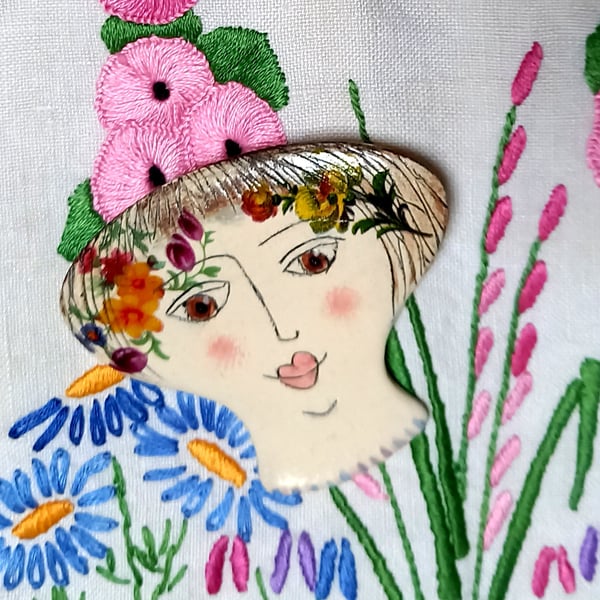 Lady face brooches 