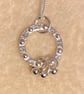 Circular silver necklace with tiny silver studs and 3 rings  - Image 2