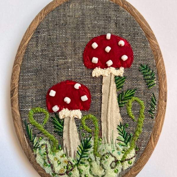 Framed embroidery. Red toadstool woodland