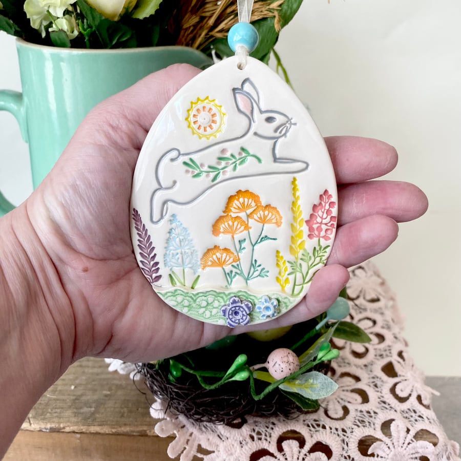 Large Ceramic Easter egg decoration leaping bunny over the meadow