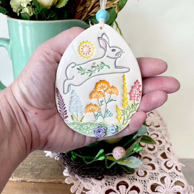 Large Ceramic Easter egg decoration leaping bunny over the meadow