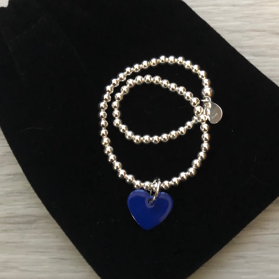 Dark blue enamel heart on silver beaded stretch bracelet. Stacking bracelet.