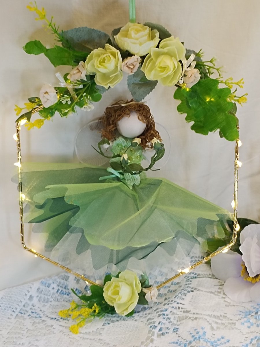 spring Fairy doll on hoop with fairy lights and yellow flowers