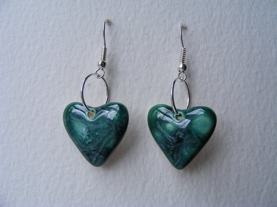 Green heart shaped earrings