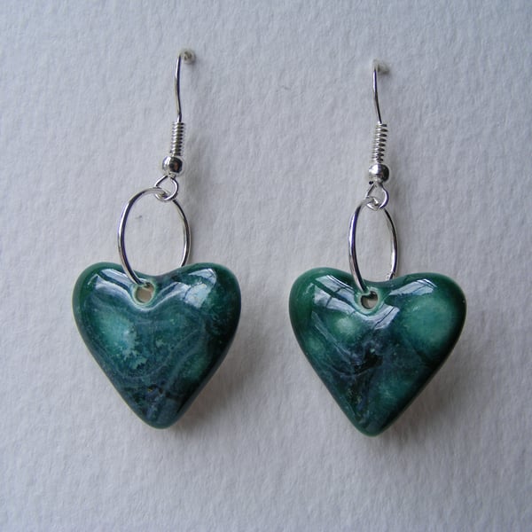 Green heart shaped earrings