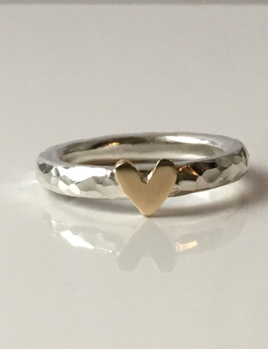 Silver ring with gold heart