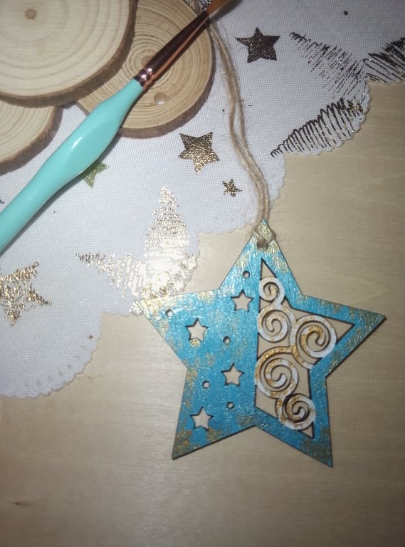 Pale blue star hanging Christmas tree decoration 