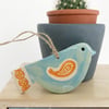 Ceramic bird decoration with patterned wing and tail 