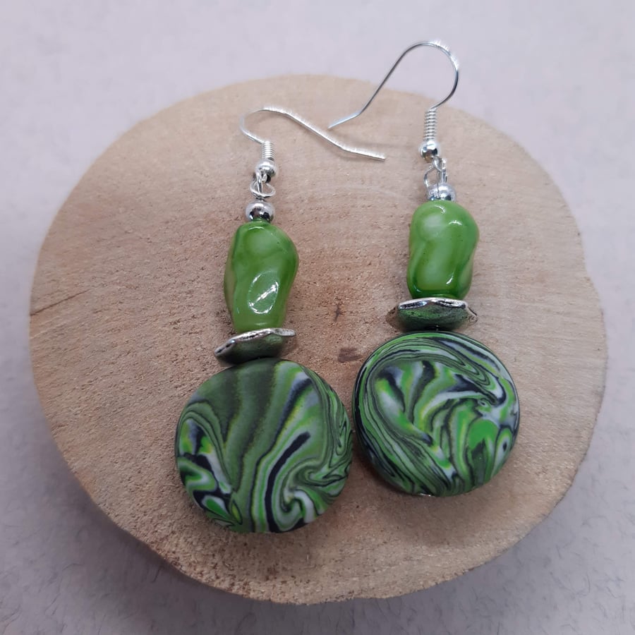 Green disc shaped earrings