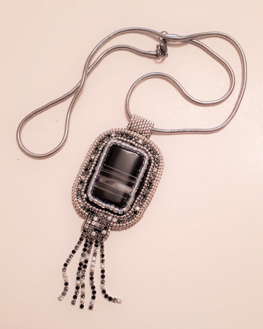 Bead embroidered Black Striped Agate pendant on a silver tone chain