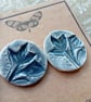 Grey flower print ceramic button earrings on surgical steel posts