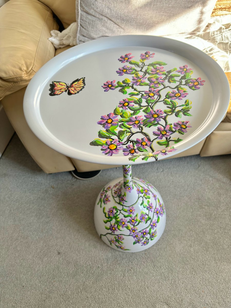 A hand painted and sealed metal table by Andrew Jenkins 