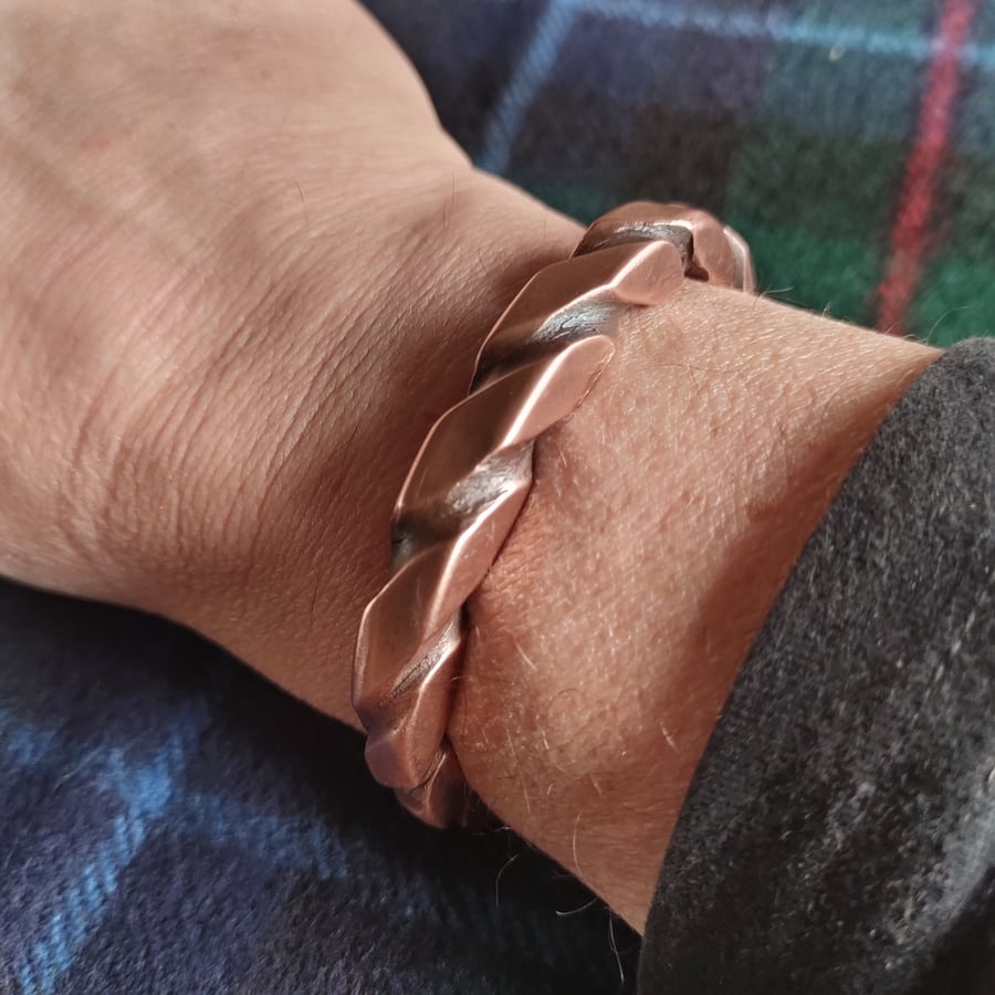 Proper copper bracelet twisted and squared. Rugged look with a refined feel.