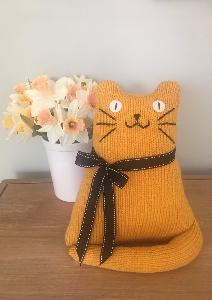 Yellow mustard cat doll hand knitted from acrylic yarn 