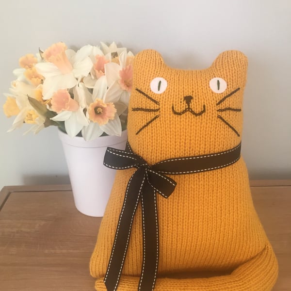 Yellow mustard cat doll hand knitted from acrylic yarn 