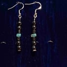 Silver earrings made with hematite a a dash of turquoise 