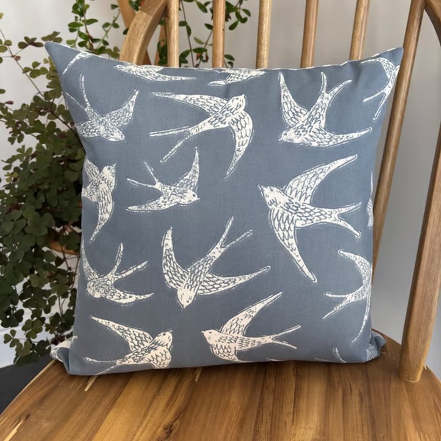 Cushion cover with a bird print in navy and white with striped back, 40cm x 40cm