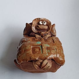 "Baby face" Ceramic Frog in Cradle Earthenware Pottery Ornament