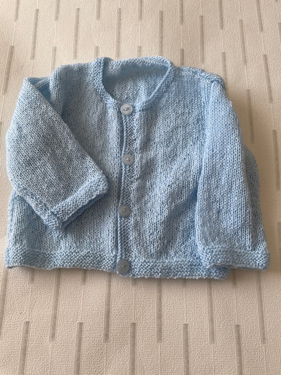Hand knitted 3ply cardigan for a young baby