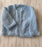 Hand knitted 3ply cardigan for a young baby - Image 1