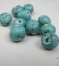 10 Small Eggshell Blue Glazed Clay Beads - Image 1