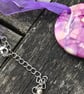 Purple patterned shell on purple ribbon - Image 2