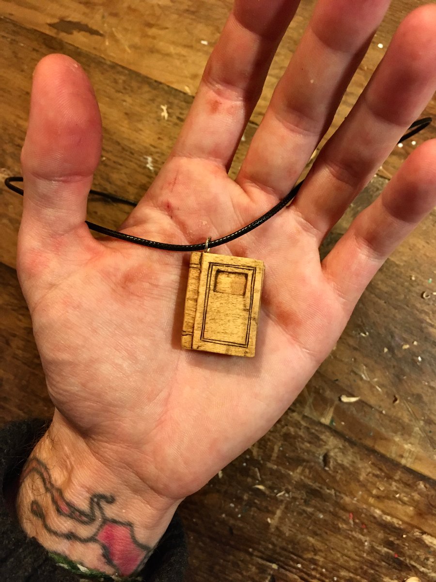 Hand Carved Book Pendant