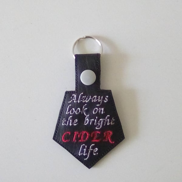630. Always look on the bright CIDER life keyring.