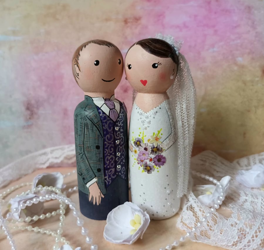 Custom wedding cake peg doll cake toppers. 