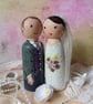 Custom wedding cake peg doll cake toppers. 