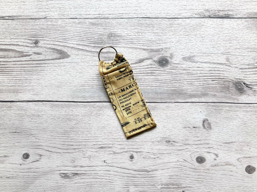 Sewing themed lip balm cotton fabric keyring.
