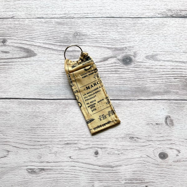 Sewing themed lip balm cotton fabric keyring.