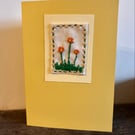 Hand embroidered yellow card with orange gerbera flowers