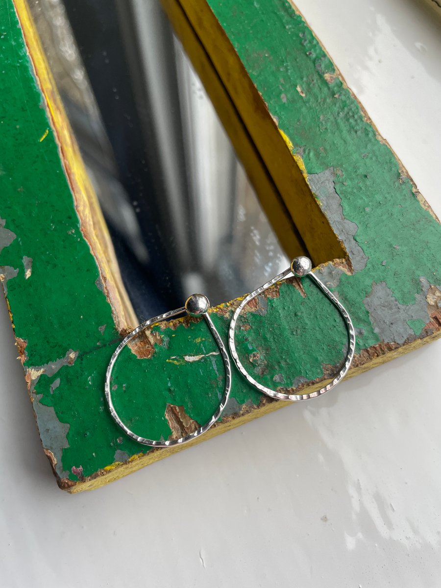 Delicate tear drop earrings with hammered texture and silver ball accent