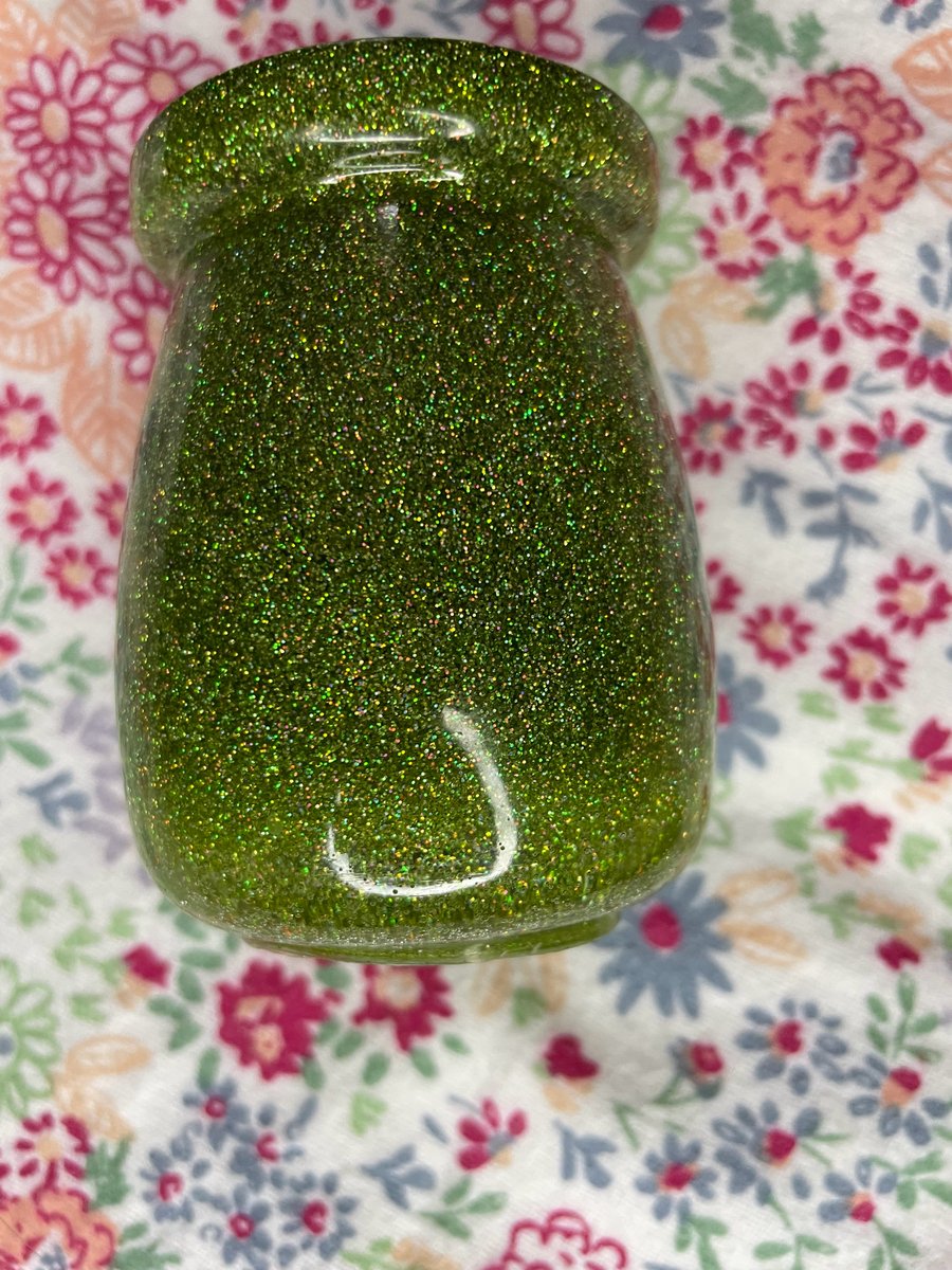 Green glittery pot with a cork stopper