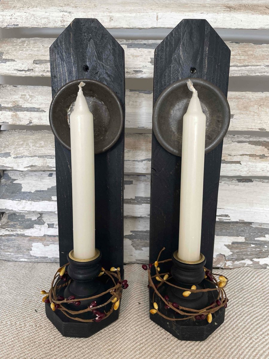 A lovely handmade pair of primitive candle holders