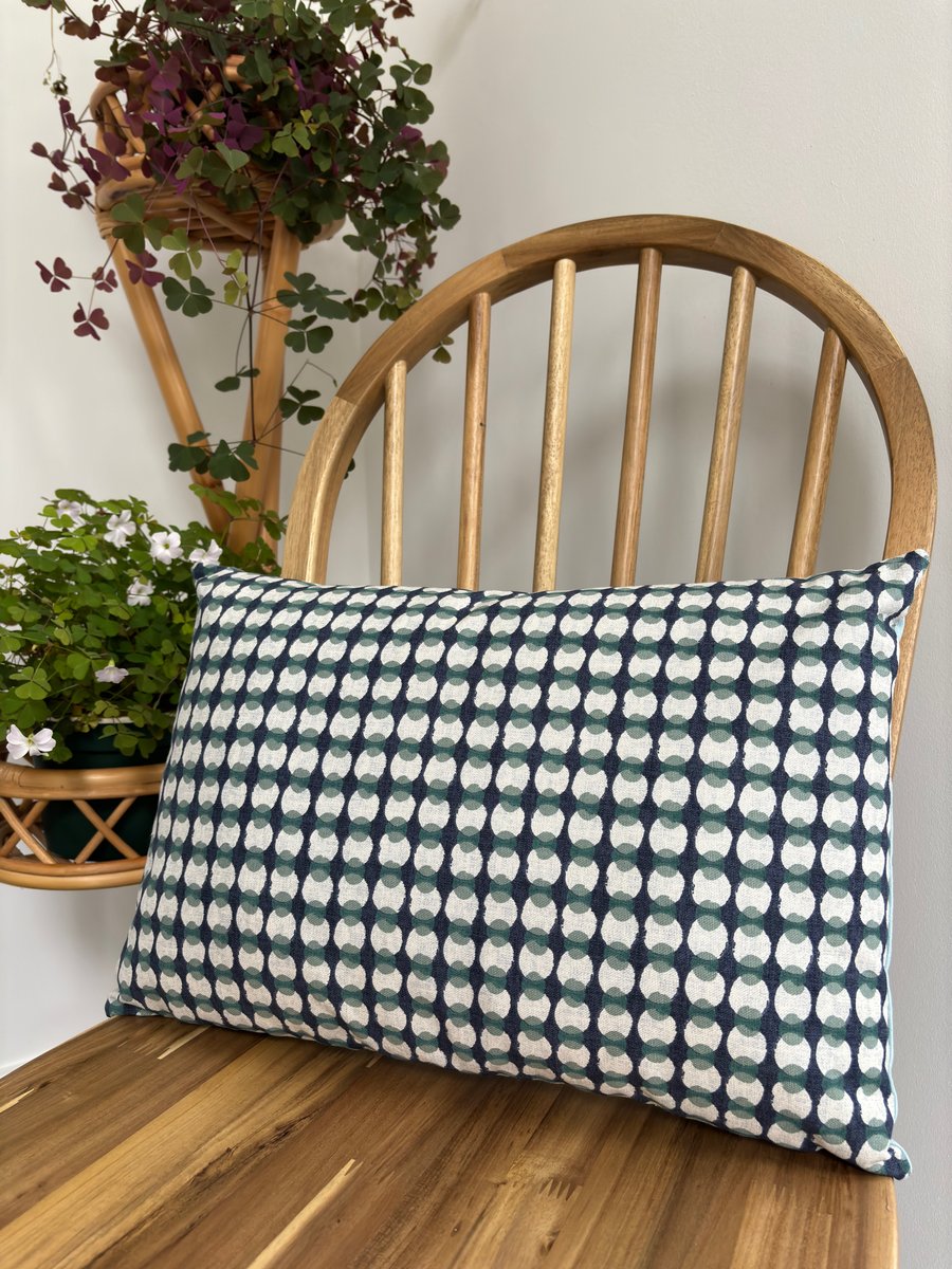 Cushion cover with a geometric print in navy and jade, 31cm x 46cm