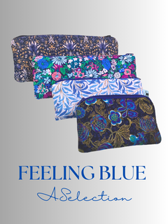 Four zipper pouches in shades of blue