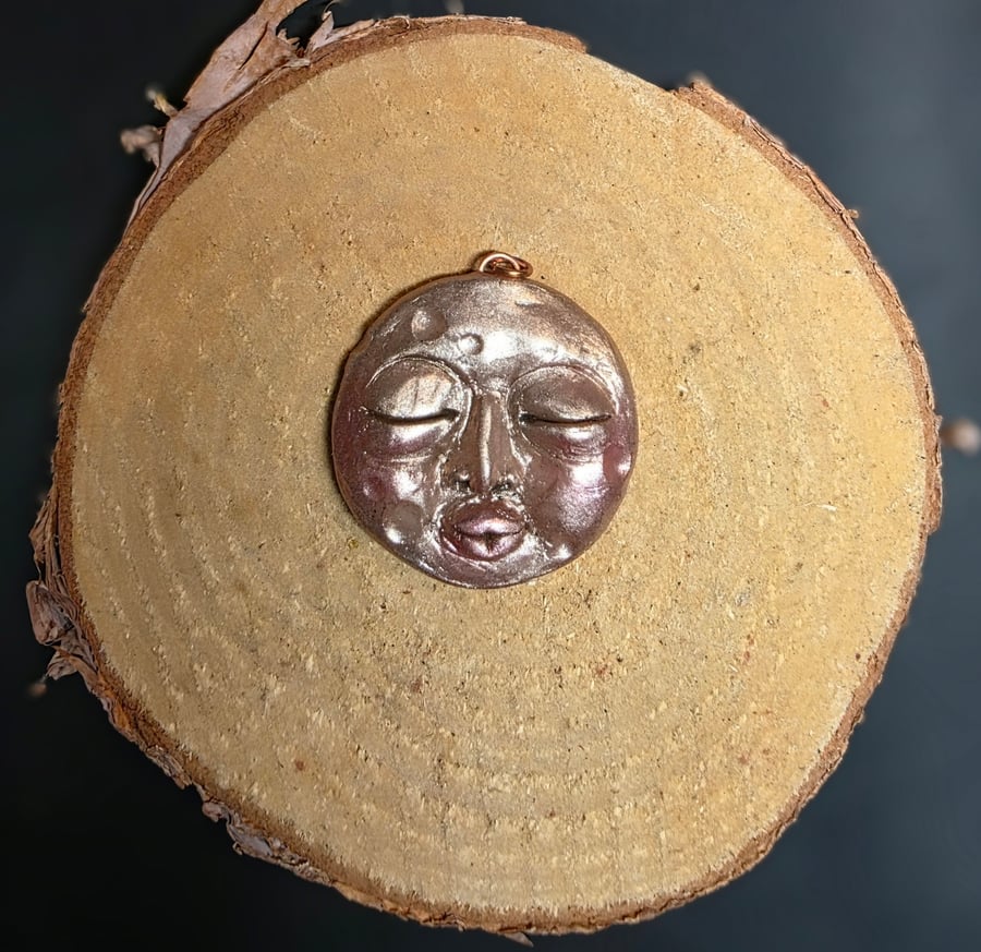 Hand sculpted moon face pendant