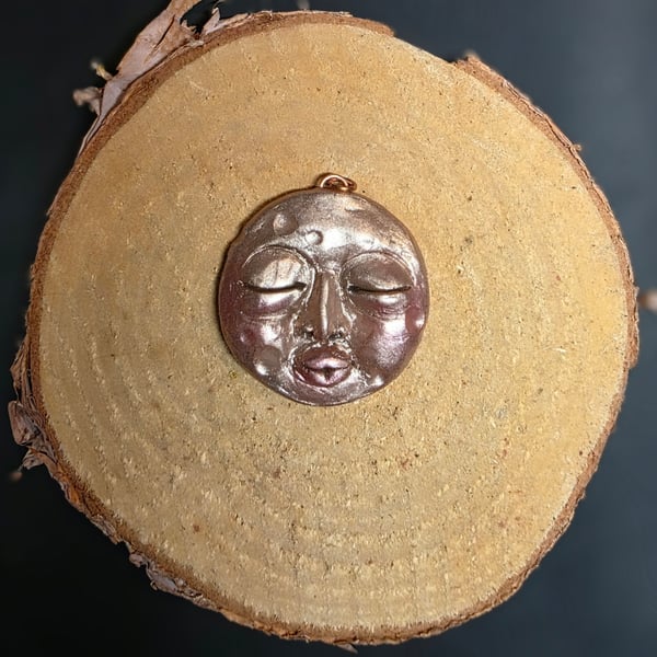 Hand sculpted moon face pendant