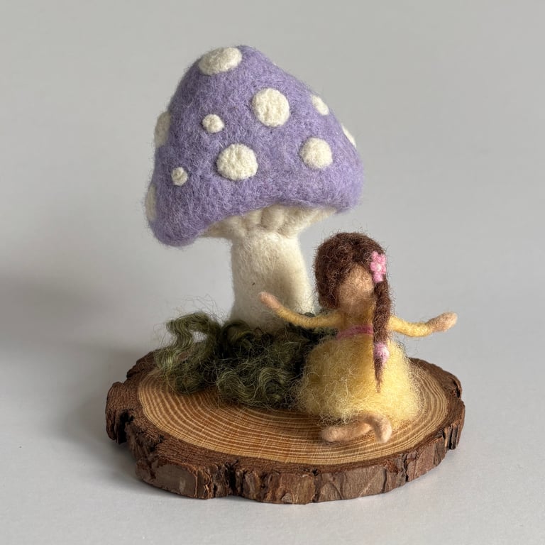 Needlefelted wool lilac toadstool and fairy dressed in yellow