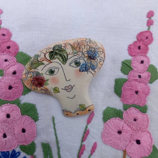 Lady face brooches 