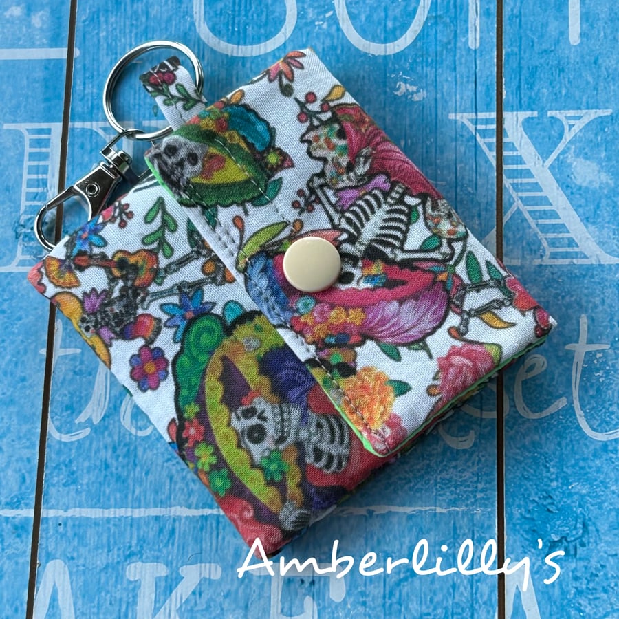 Ear bud pouch or keychain pouch for bag skull design skeletons fabric