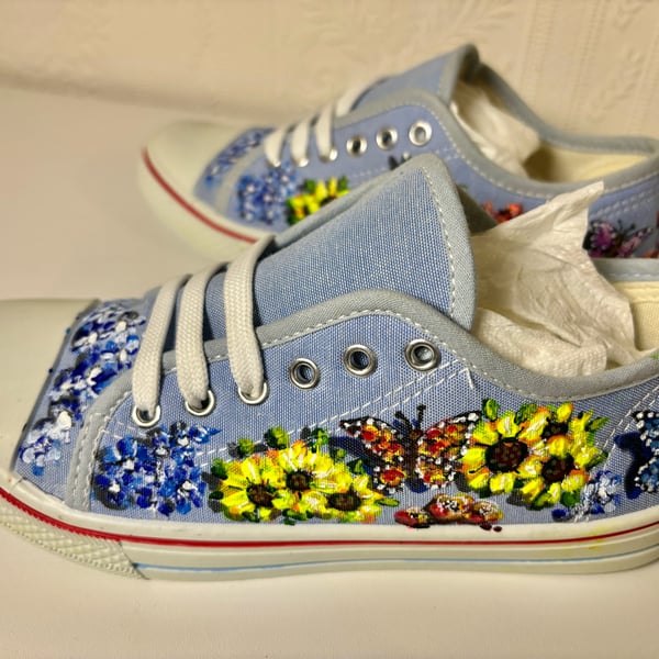 A pair of hand painted and sealed shoes by Andrew Jenkins 