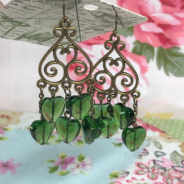 Green glass heart chandelier earrings 