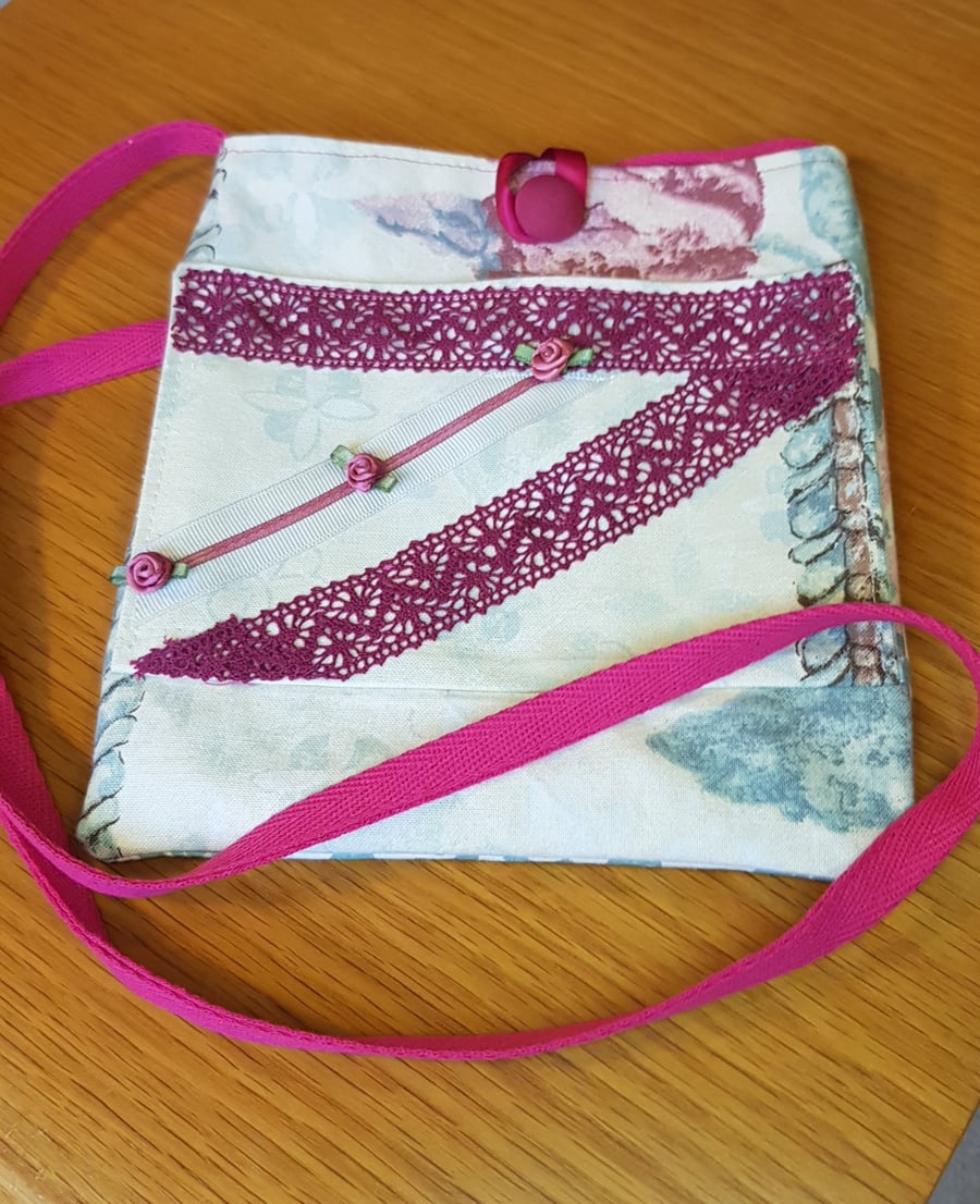 Crossbody bag; cream with burgundy lace