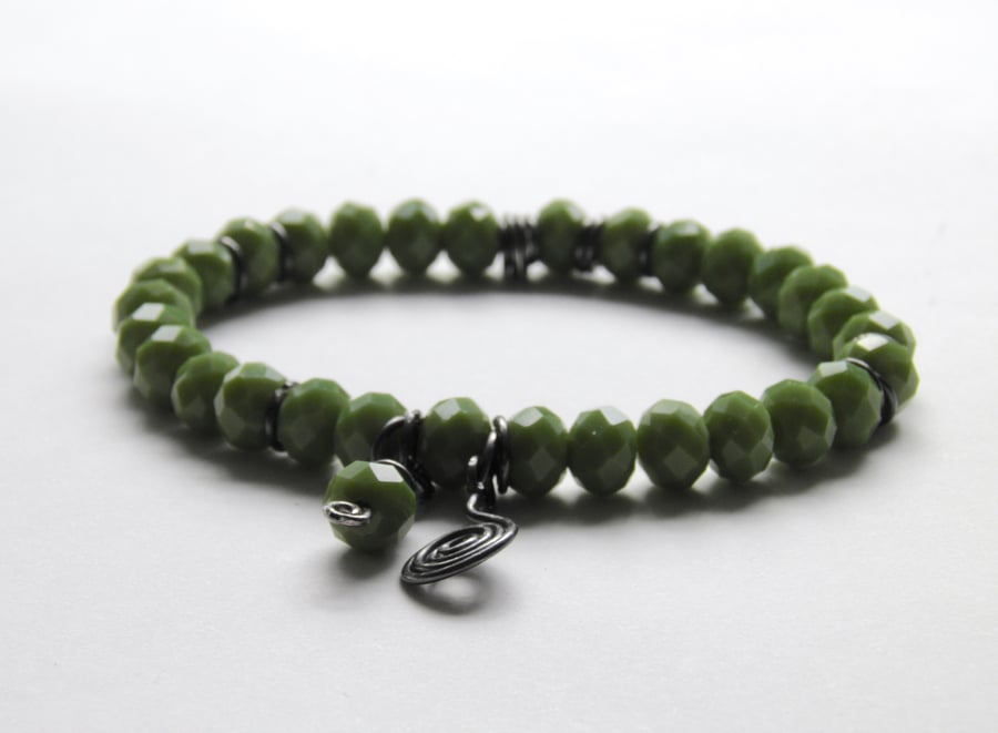 Green Bracelet with Oxidised Silver Swirl Charms